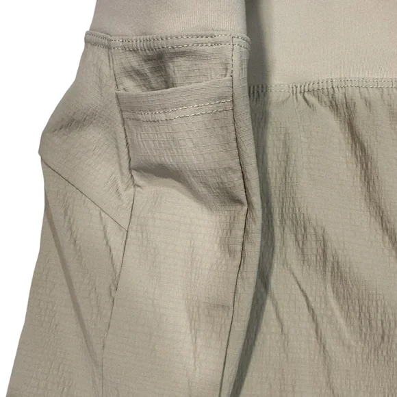 ATHLETA Trekkie North Short UPF Secure Pockets Tan Neutral NWT 16 - Picture 7 of 13
